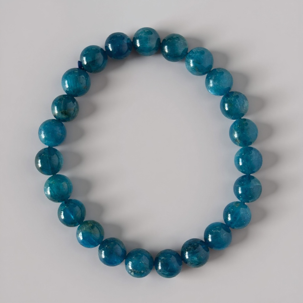 High grade natural Blue Apatite bracelet with 7 mm beads. Known for clarity, motivation, and calming energy. Beautiful ocean-blue tones.