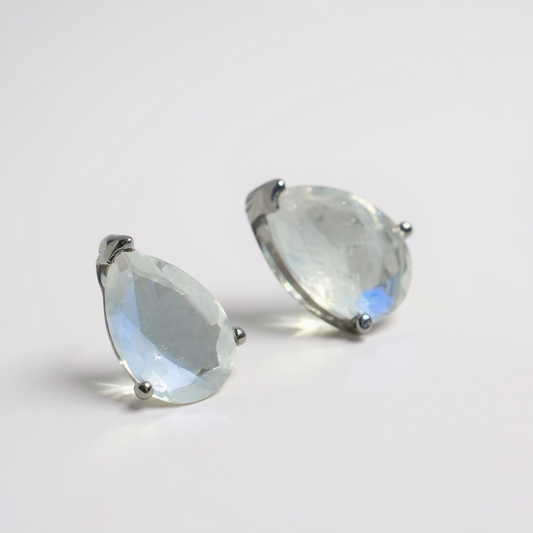 Blue moonstone teardrop studs in sterling silver. Soft shifting blue glow. One-of-a-kind pair.