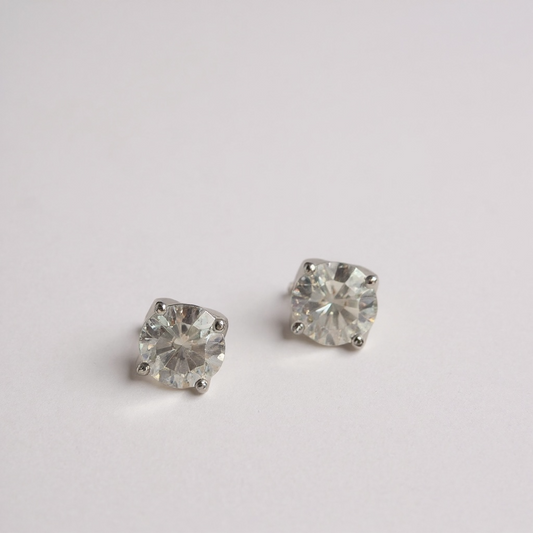 3 mm moissanite stud earrings in sterling silver. Elegant, minimalist sparkle with a classic four-claw setting. 