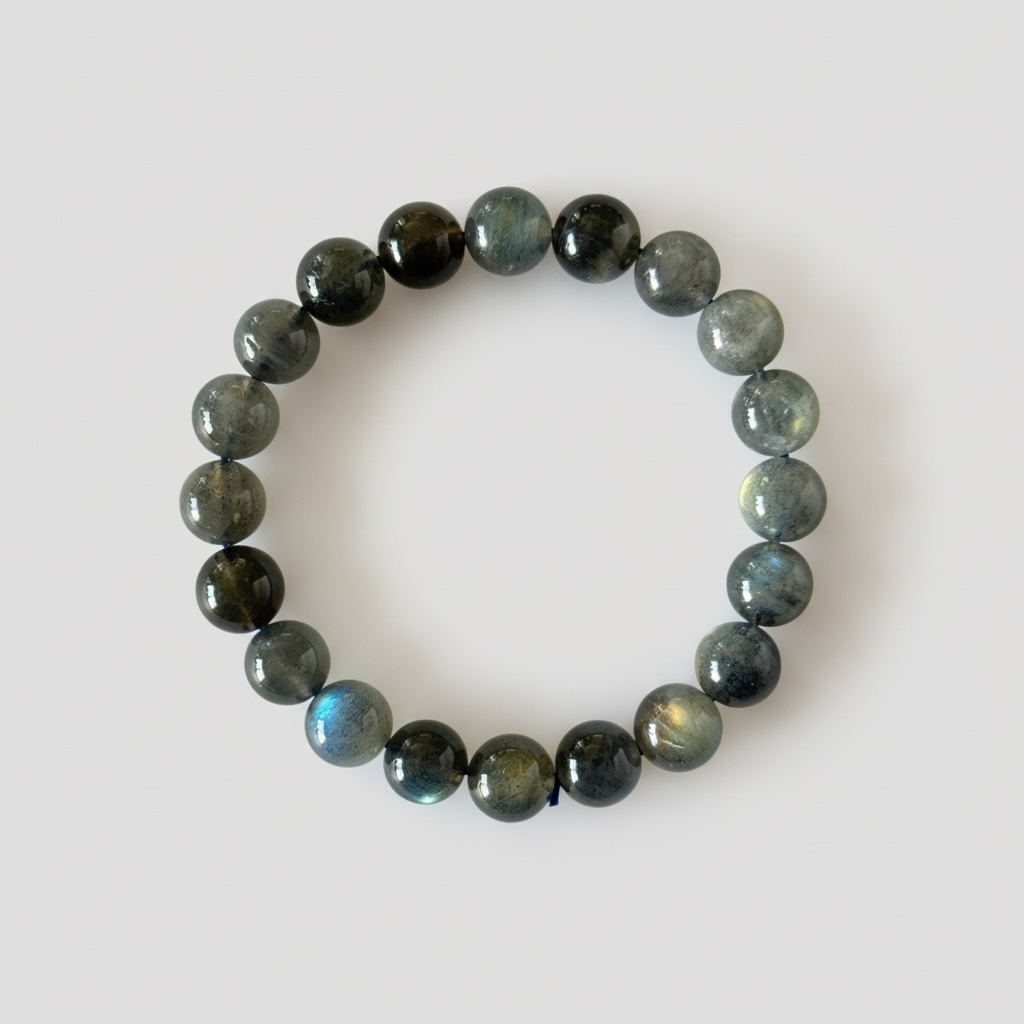 High grade natural Labradorite bracelet with 9 mm beads. Beautiful blue-gold flash, known for protection and personal transformation.