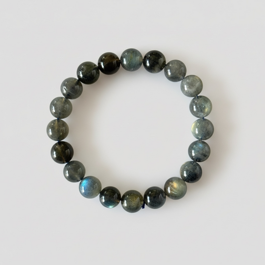 High grade natural Labradorite bracelet with 9 mm beads. Beautiful blue-gold flash, known for protection and personal transformation.