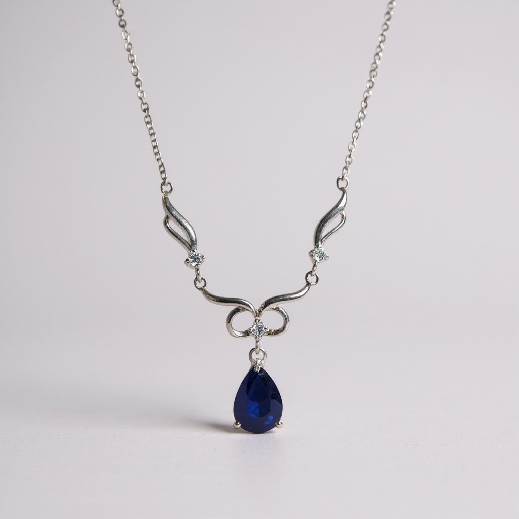 Sapphire Teardrop Bow Necklace – Sterling Silver (20–24 cm)